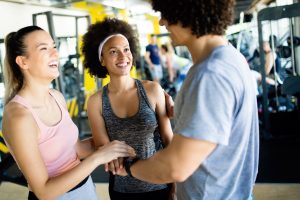 Picture of cheerful fitness team in gym