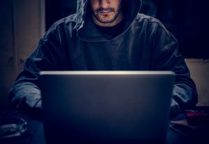 Hacker working on computer cyber crime